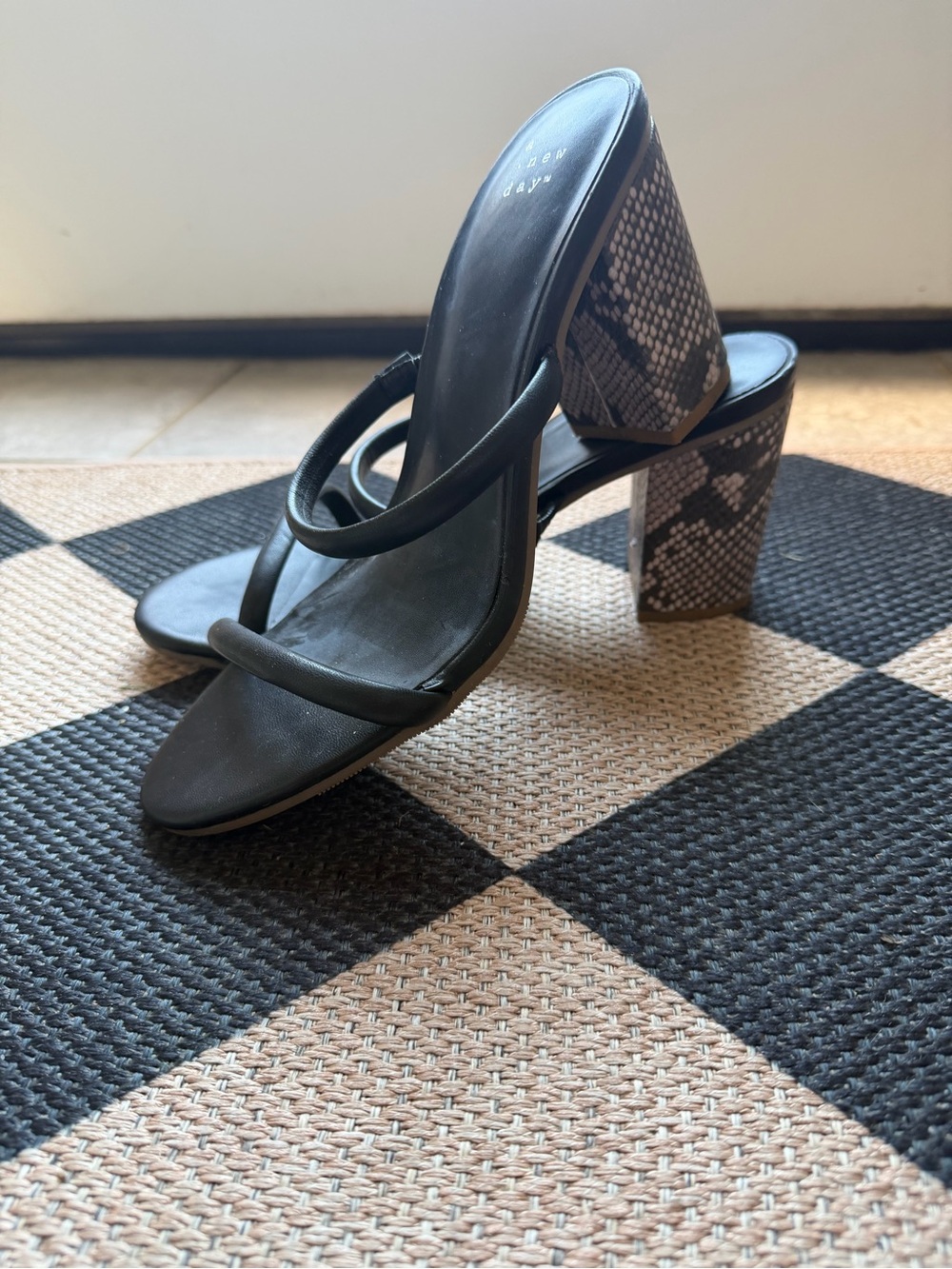 A New Day, black strappy heels